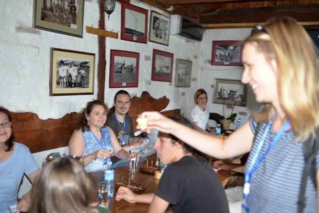 A group of people in a room

Description generated with very high confidence