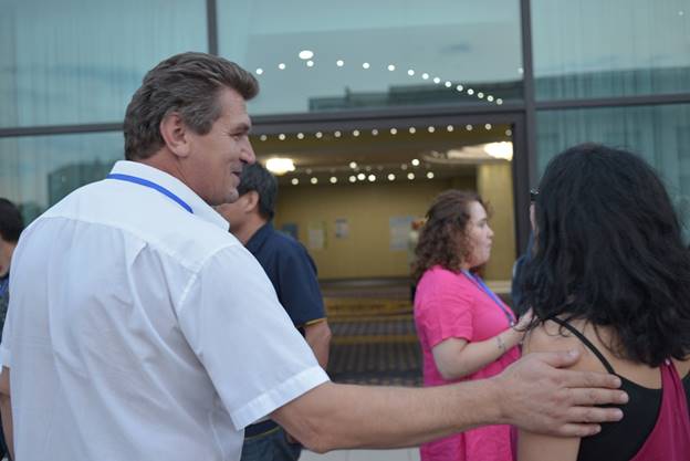 A group of people holding wine glasses

Description generated with high confidence