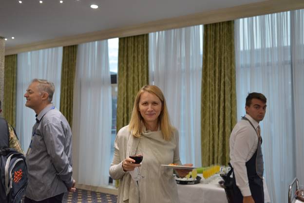 A person standing in front of a window

Description generated with very high confidence