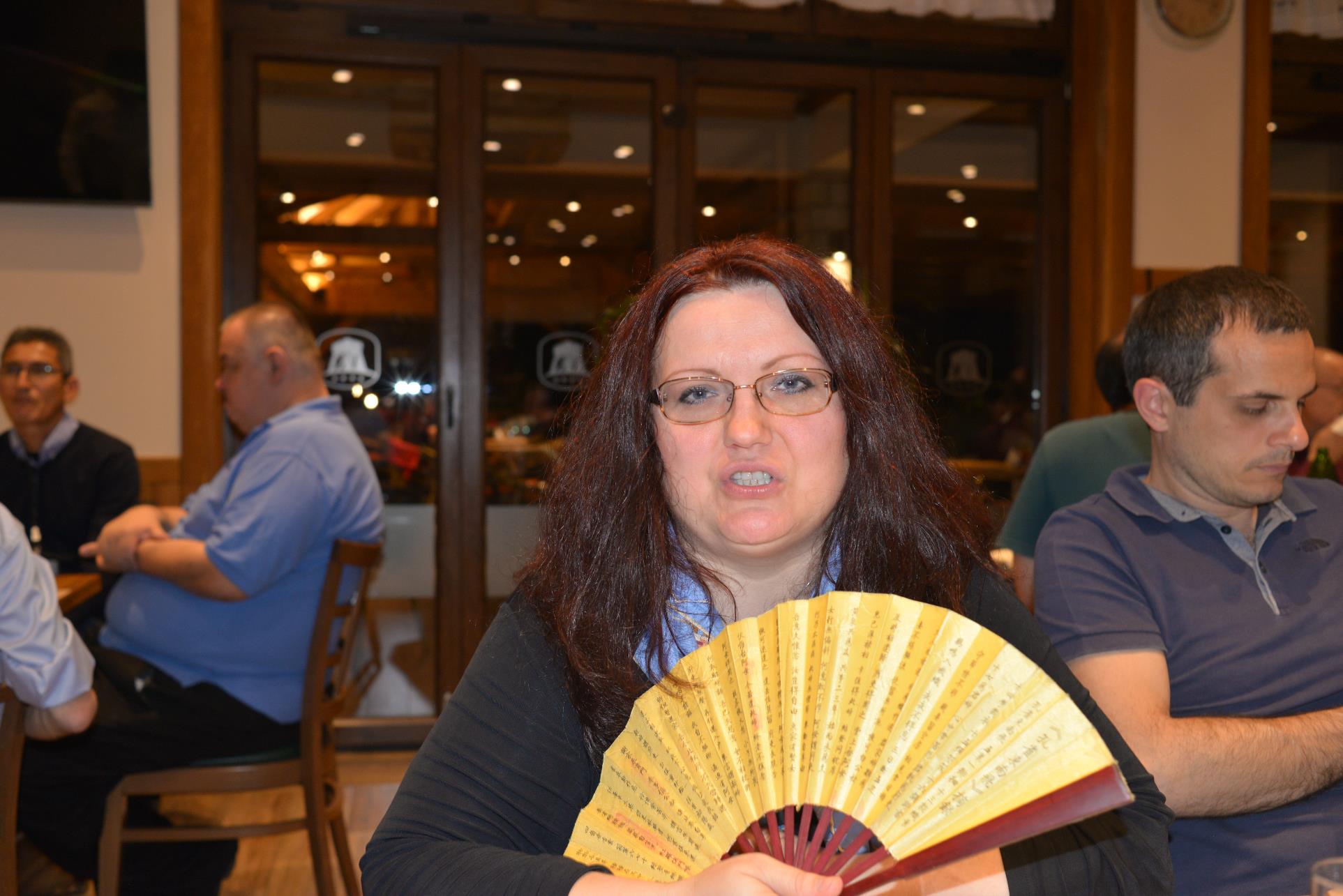 A group of people sitting at a table

Description automatically generated