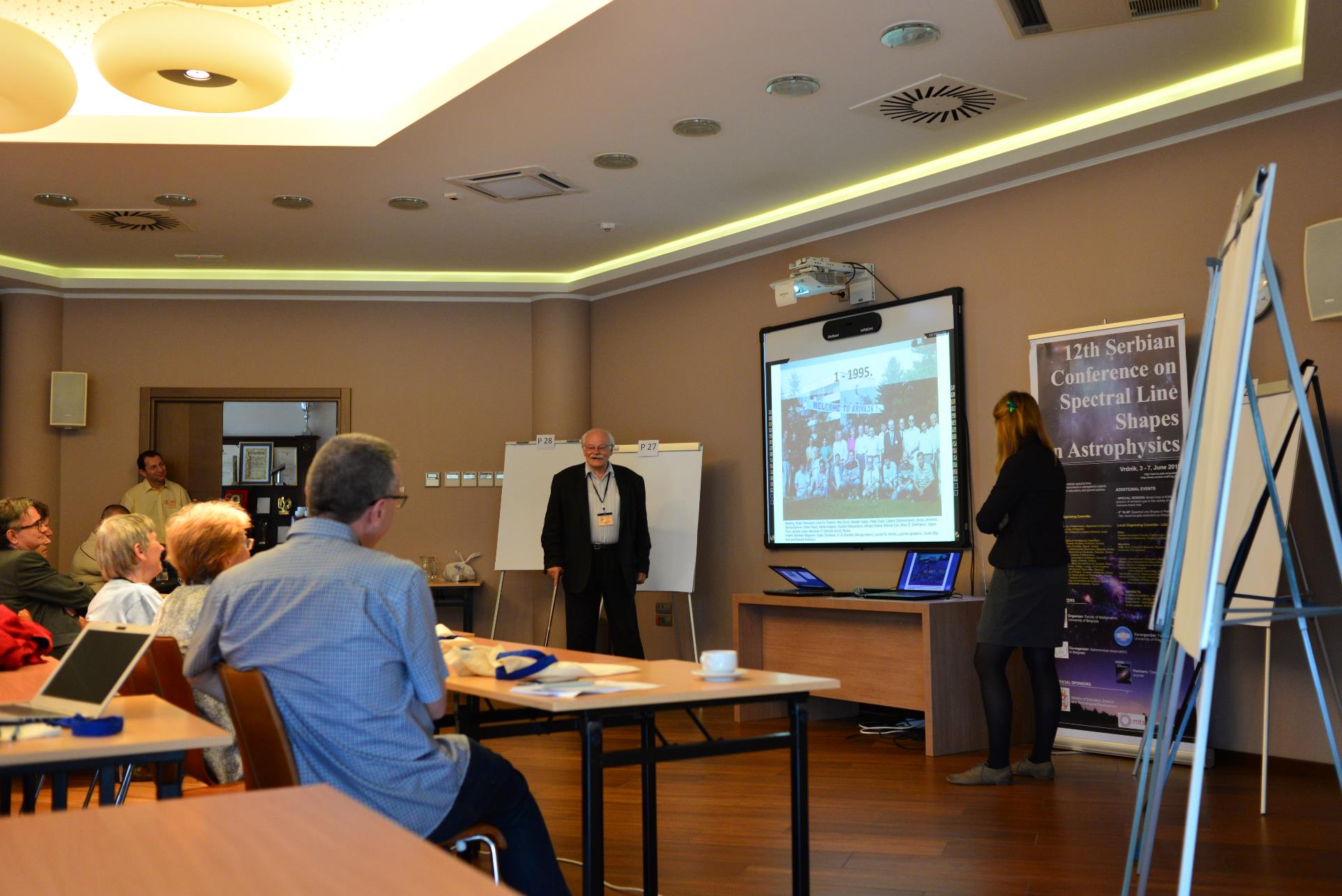 A group of people in a room

Description automatically generated